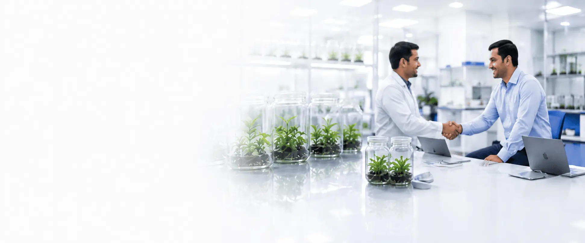 Team members shaking hands in the lab